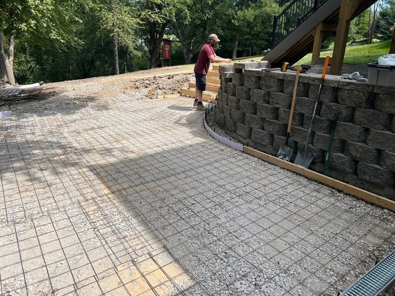 Custom outdoor kitchen, patio, and retaining wall
